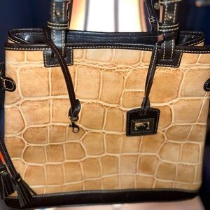 Dooney & Bourke Croc-Embossed mustard/yellow with brown accents.